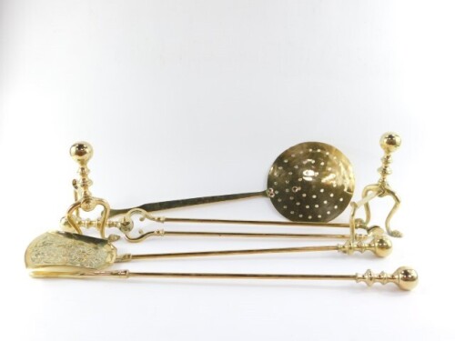 A Victorian brass fireside set, comprising a poker, shovel and pair of coal tongs, together with a pair of andirons and a brass and copper riveted skimer. (6)