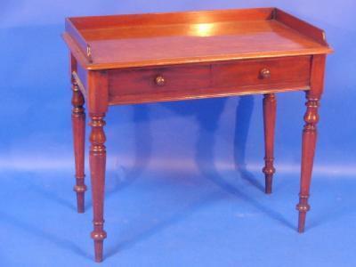 A 19thC mahogany side table with three quarters gallery two frieze drawers