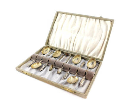 A set of six Victorian silver apostle coffee spoons, and matching sugar tongs, with fluted shell shaped bowls, cased, William Devenport, London 1900, 1.70oz.