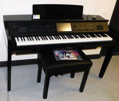 A Yamaha Clavinova CVP-809, in a black high gloss finish, with electronic touch screen panel, on a soft close lid, with Yamaha stool, owners manual and other Yamaha materials, 95cm high, 143cm wide, 60cm deep.