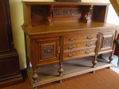 A Victorian carved oak side board