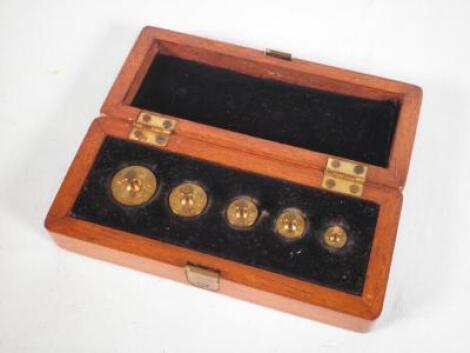 A set of City of Lincoln brass penny weights by De Grave & Co