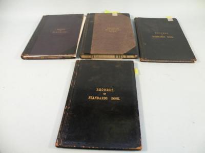 Four working local standards ledgers by Shaw & Sons Printers