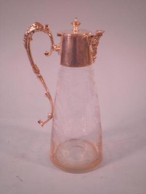 A Victorian cut glass claret jug decorated with flowers