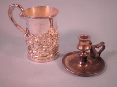 A silver plated tankard cast with putti amid rushes with dolphins etc.