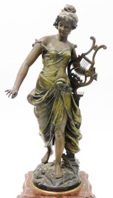 A late 19thC French clock garniture, with mantel clock, on a red marble base with a gilt spleter figure of a maiden with a harp to top titled Harmonie, with a cream coloured floral dial, 8cm wide, eight day chiming movement, on rococo style feet, with two - 4