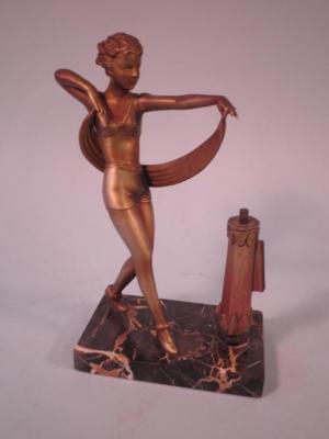 A 1920's/30's spelter table lighter in the form of a lady dancing