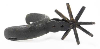 A 19thC iron boot spur, with revolving wheel on boot clip, 16cm long overall.