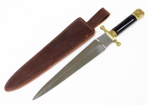 A large dagger, with mahogany ebonised handle and brass hammered end, the blade stamped Middleton & Sons Rockingham Street Sheffield, in a brown leather sheath, 41cm long.