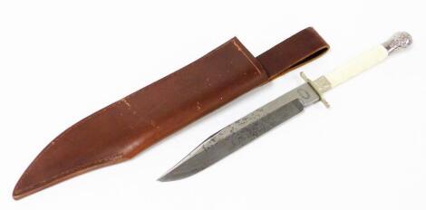 A Tiffany Broadway American knife, with a bone handle and silver plated scroll design ends, the blade with various engravings marked New York USA, with later leather sheath, 31cm long overall.