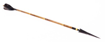 A short arrow, with hammered end, bamboo shaft and feathers, 64cm long. (AF)