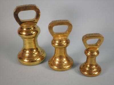 A set of three brass weights for the City of Lincoln dated 1901
