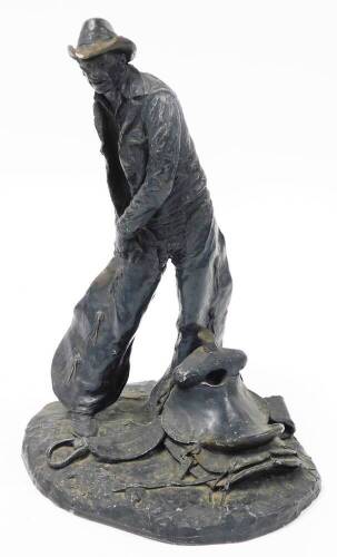 After Michael C Garman. Taking The Rough Off, bronze finished resin figure of a cowboy, signed and dated 1972, 42cm high. (AF)