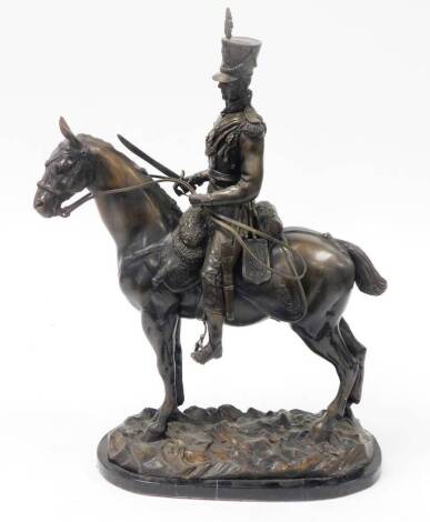 A 20thC bronze figure of a British mounted cavalry officer of the 17th/21st Lancers, on a black marble plinth, 57cm high.