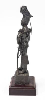 A bronze patinated regimental resin figure of an officer of the 17th/21st Lancers, on a wooden plinth, 42.5cm high, 7cm wide, 6cm deep, the base 4cm high, 13cm wide, 13cm deep. - 2