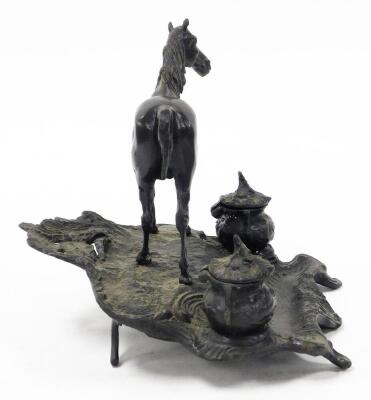 A bronze desk stand mounted as a standing horse, on a rustic stand incorporating two ink recesses and pen rest, with rococo scroll feet, 22cm high. - 4