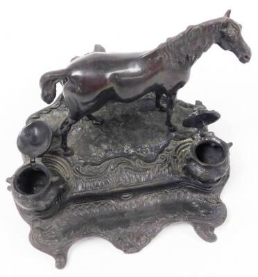 A bronze desk stand mounted as a standing horse, on a rustic stand incorporating two ink recesses and pen rest, with rococo scroll feet, 22cm high. - 5