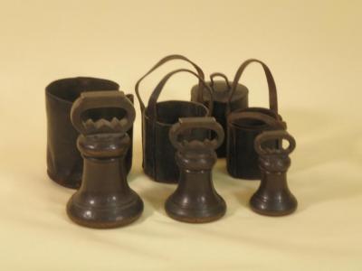 A set of three Victorian bell metal weights for Kesteven dated 1857 - 56lb