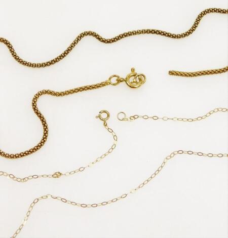 Two chains, comprising a modern chain, gold coloured, marked 800, (AF), 4.5g, and a fine link 9ct gold chain, 0.3g. (2)