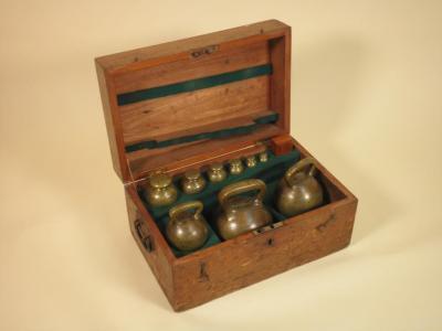 A set of bell metal weights for Lindsey County Council dated 1912 by De Grave & Co Ltd.