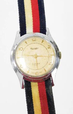 A Rotary gentleman's wristwatch, on a stainless steel back with seventeen jewel movement stamped UM, in a steel backing with key wind on a material blue, red and white ribbon strap, the dial 2.5cm wide.