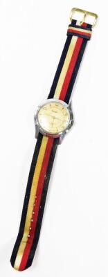 A Rotary gentleman's wristwatch, on a stainless steel back with seventeen jewel movement stamped UM, in a steel backing with key wind on a material blue, red and white ribbon strap, the dial 2.5cm wide. - 2