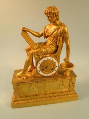 An early 19thC French ormolu mantel clock in the form of a neo-classical