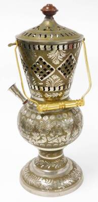 An Eastern shisha pipe, the main body in steel with a gold coloured coating, various piercing and engraving, on a steel body, with a wooden top, on a circular foot, the material pipe with wooden ends, and a gold coloured carrying handle, 53cm high. - 4