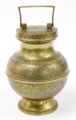 An Eastern copper storage canister, with screw on top with single handle, on a shaped body with hammered floral decoration picked out with red enamelling to lid and blackening to the bod, on circular foot, unmarked, 23cm high.