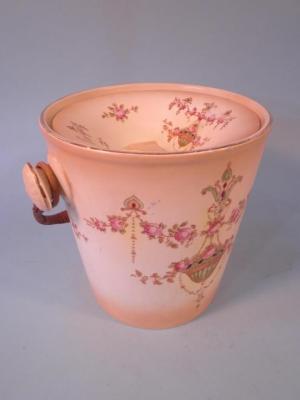 A Fieldings Devonware slop pail and cover decorated with flowers