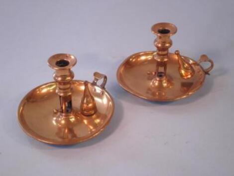 A pair of Victorian brass chamber sticks and snuffers