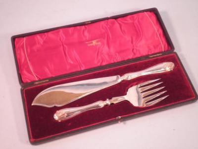 A set of silver plated fish servers by Walker & Hall in a fitted