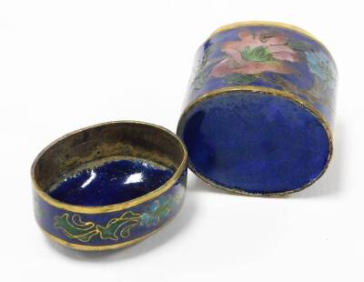 Two oriental cloisonné trinket boxes, the oval example with blue enamel cloisonné decoration on brass, depicting pink and blue flowers 4cm high with lift up lid, the imitation cloisonné urn shaped trinket box, with similar decoration 6cm high. (2) - 5