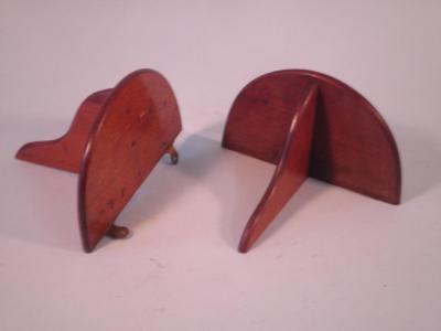 A pair of Victorian mahogany demi lune wall brackets