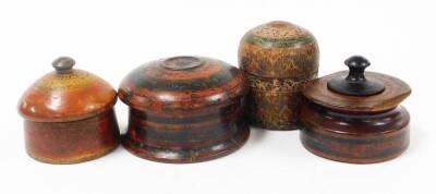 Four wooden Eastern storage jars, each of varying design, two with red and black lacquering, and others. (4)