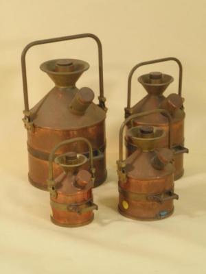 A set of four copper and brass petrol measures for Lindsey County Council Lincolnshire