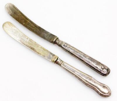 A group of silver six pences and two silver handled butter knives, comprising twenty two six pence pieces, a Birmingham assay silver handled butter knife, and another white metal butter knife unmarked. (a quantity) - 3