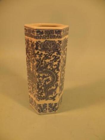 A Chinese hexagonal porcelain vase decorated with dragons and scrolls