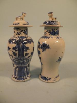 A pair of 19thC Chinese porcelain baluster shaped vases and covers