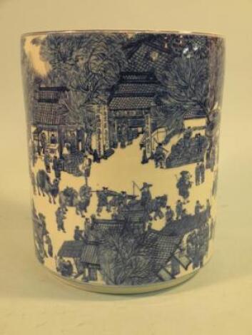 A Chinese porcelain cylindrical jardiniere decorated with figures and buildings