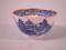 An English porcelain tea bowl printed with a Chinese landscape