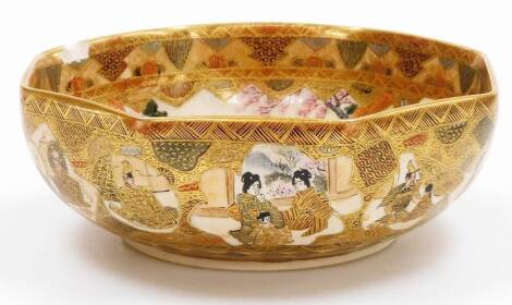 A Japanese Satsuma Earthenware hexagonal bowl, decorated in colours and heavy gilt with shaped panels of sages, samurai, women and children within double diaper border, the exterior with similar panels, Meiji period, 18cm wide. (AF)