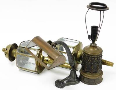 A group of lamps and lights, to include an arched desk lamp, a brass based table lamp, and a pair of converted railway lamps, with etched glass panels. (4)