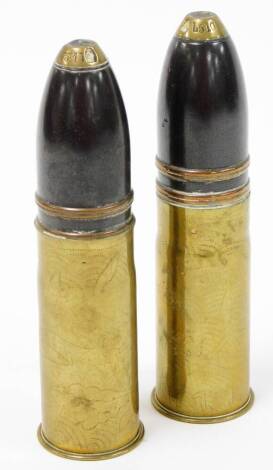 Two shell cases, each with hammered detailing of where they were found, one labelled Uskub 1918, the other Onent 1918, each stamped PDPS 332117, 17cm high.