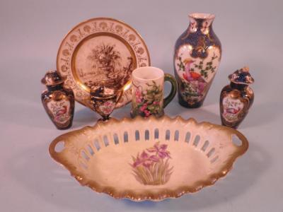 A Paris porcelain plate decorated with an urn within a landscape in black