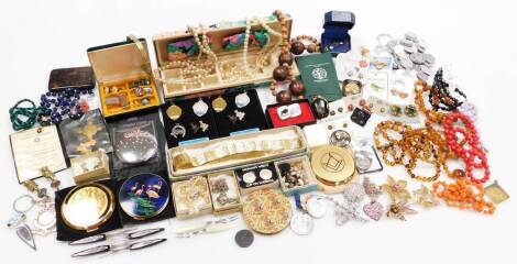 A quantity of costume jewellery and effects, to include a faux pearl necklace, beaded necklaces, tortoiseshell cigarette case, Tram Car collectors tokens, buttons, chains, etc. (2 tray)