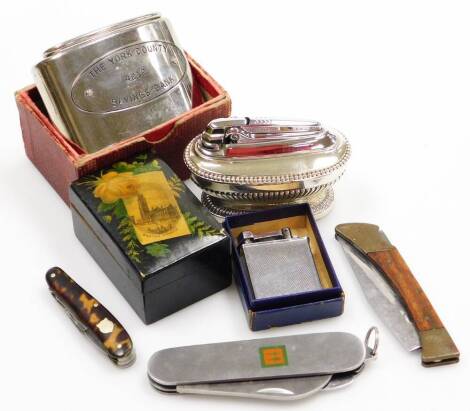 Various lighters pen knives and trinket boxes, to include a steel camping knife, a wooden handled and stainless steel hunting knife, a tortoiseshell pen knife, a York County savings bank money tin, two lighters and a Boston Church Mauchline box. (a quanti