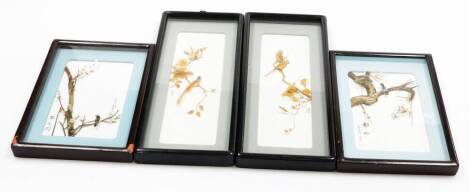 A group of Oriental bird pictures, each with straw and cane detailing of birds on a branch, two of tall rectangular form, in black lacquer frames with gold hooks, 18cm high, 9cm wide, the smaller 19cm high 11cm wide. (4)