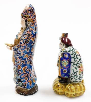 Three various early 20thC porcelain figures, comprising a standing Chinese lady holding scroll, polychrome decorate in blue and green robes, 28cm high, a figure of a bearded gentleman and two seated figures in flowing robes, polychrome decorated. (3, AF, - 3