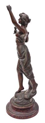 A late 19thC cast figure of a female, in dress with a flower, on a turned wooden base, 50cm high. - 2